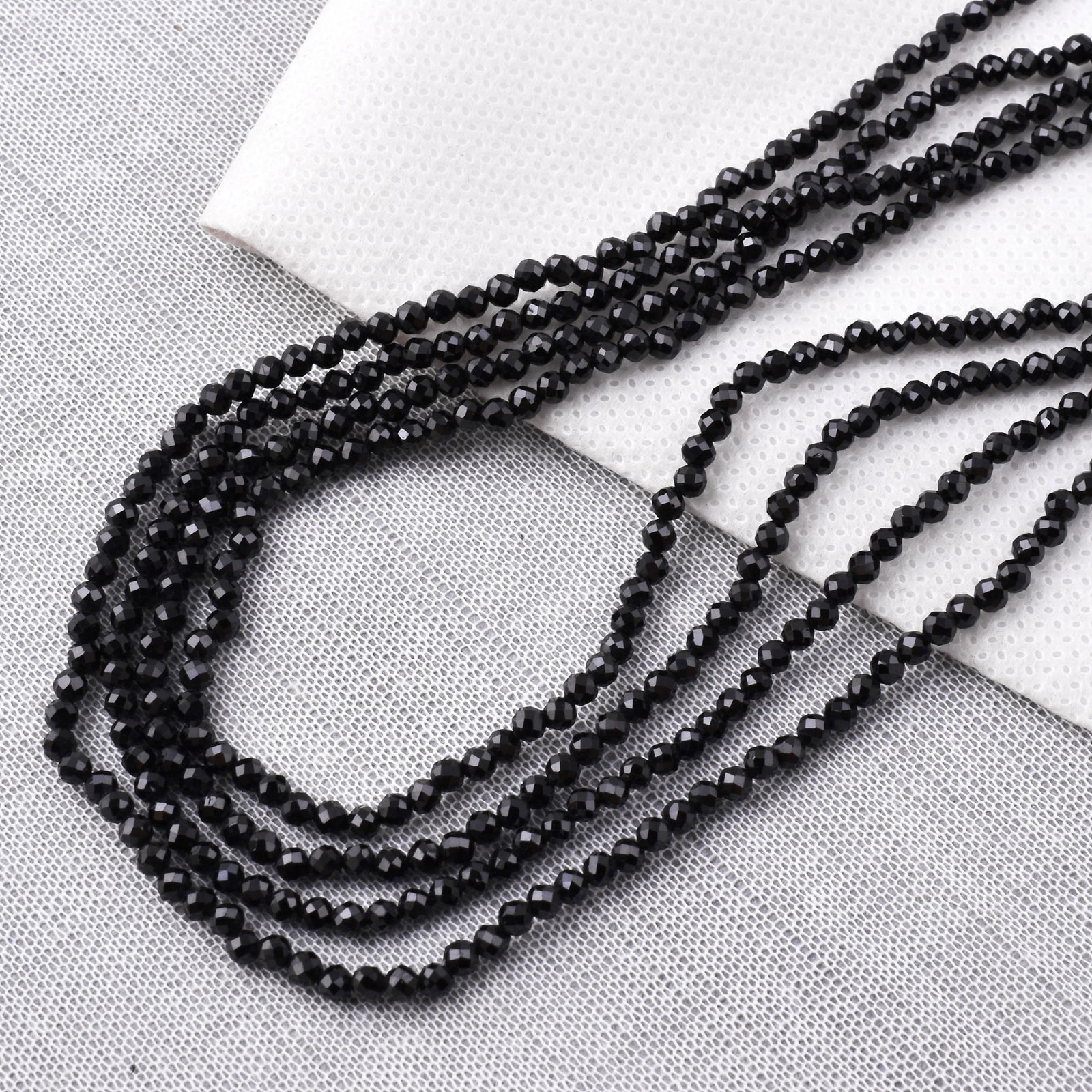 Natural Black Tourmaline 3 MM Round Faceted 4 String Beads Necklace: Natural Black Tourmaline 3 MM Round Faceted 4 String Beads Necklace Product Type : Necklace Main Stone : Black Tourmaline Main Stone Shape : Round Main Stone Size : 3 MM Beads Type : Faceted