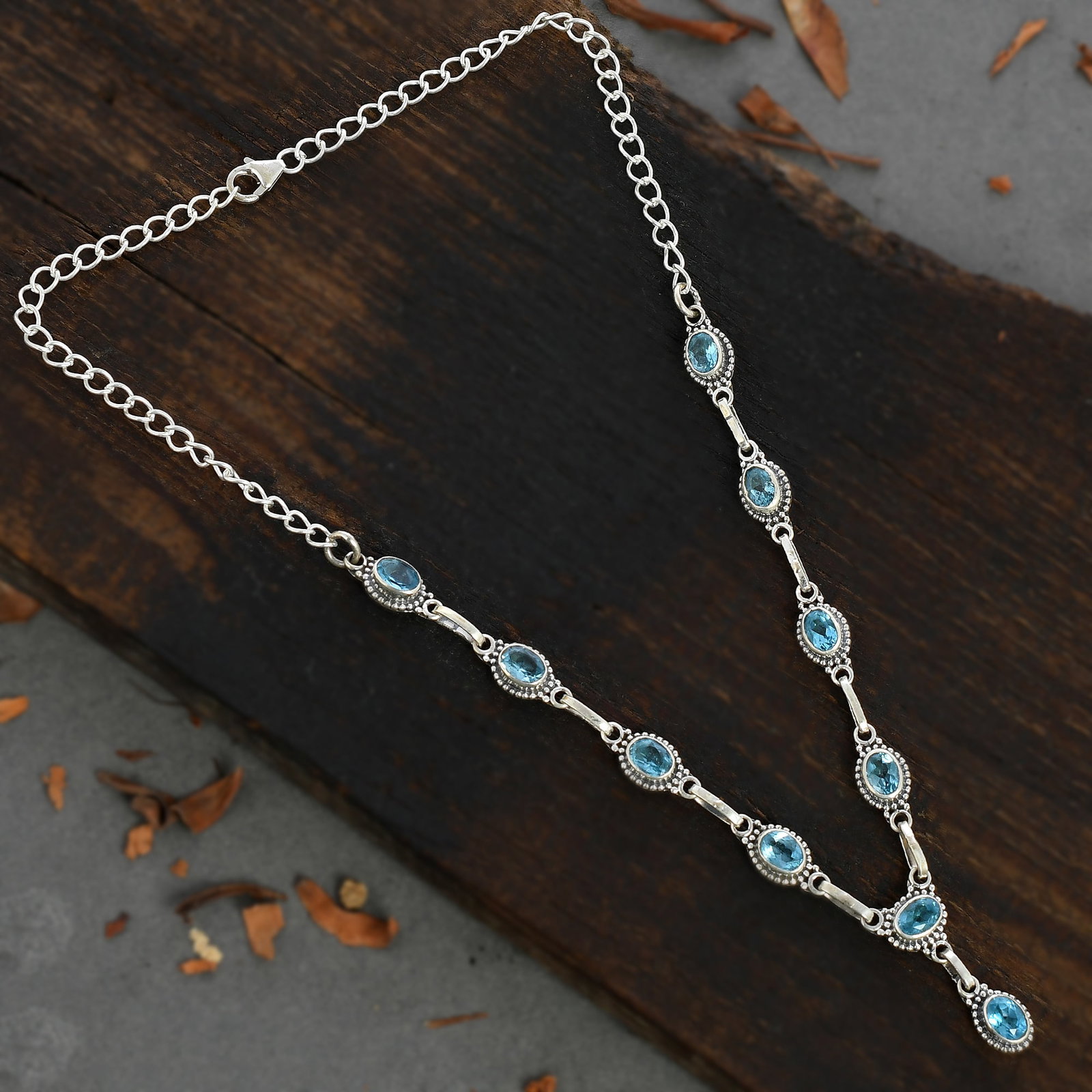 BLUE TOPAZ GEMSTONE 92.5 STERLING SILVER NECKLACE: BLUE TOPAZ GEMSTONE 92.5 STERLING SILVER NECKLACE Product Type : NECKLACE Main Stone : BLUE TOPAZ Main Stone Shape : OVAL Main Stone Size : 7X5 MM Main Stone Color : BLUE Metal : STERLING SILVER Metal
