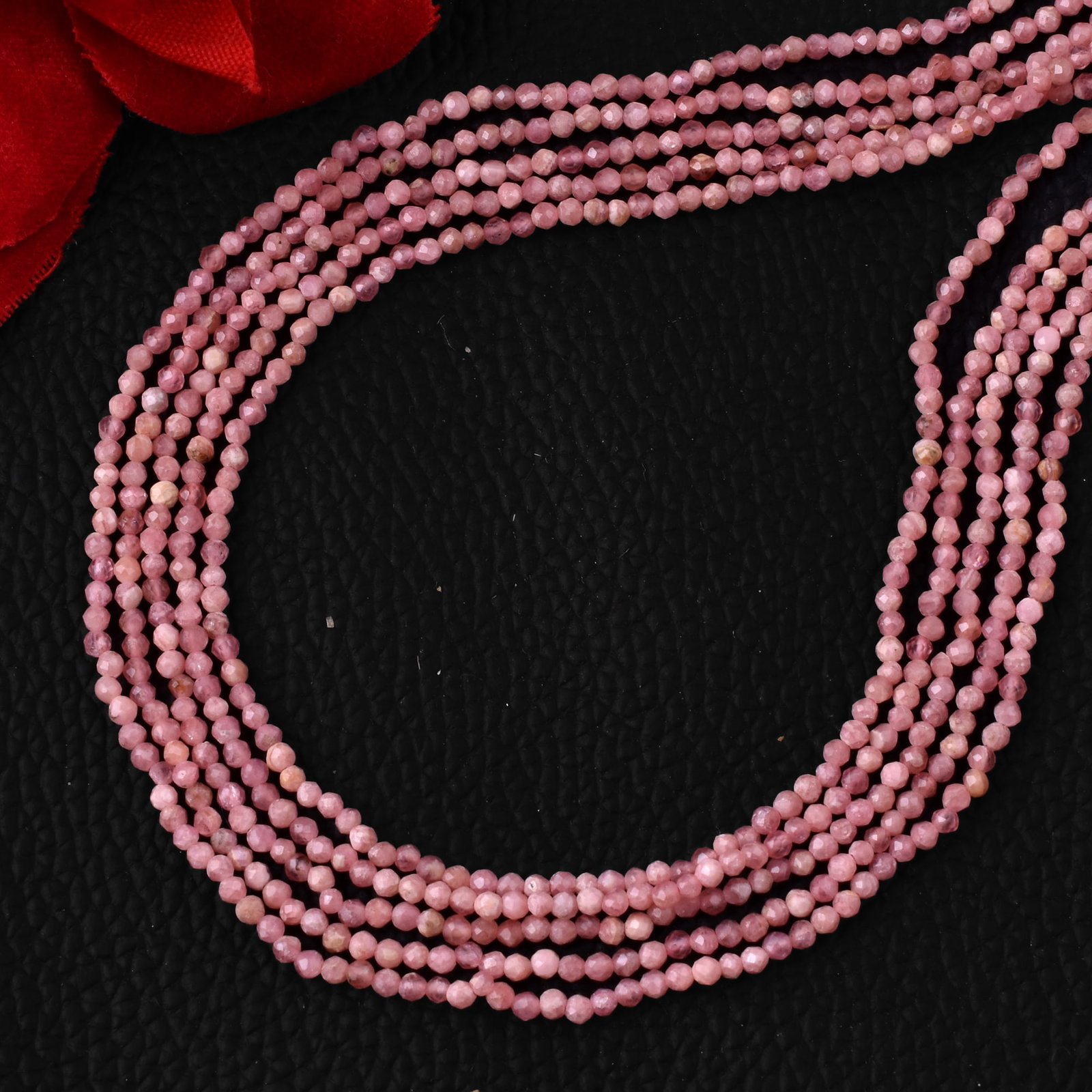 Natural Rhodonite 2 MM Round Faceted 5 String Beads Necklace: Natural Rhodonite 2 MM Round Faceted 5 String Beads Necklace Product Type : Necklace Main Stone : Rhodonite Main Stone Shape : Round Main Stone Size : 2 MM Beads Type : Faceted Closure Type