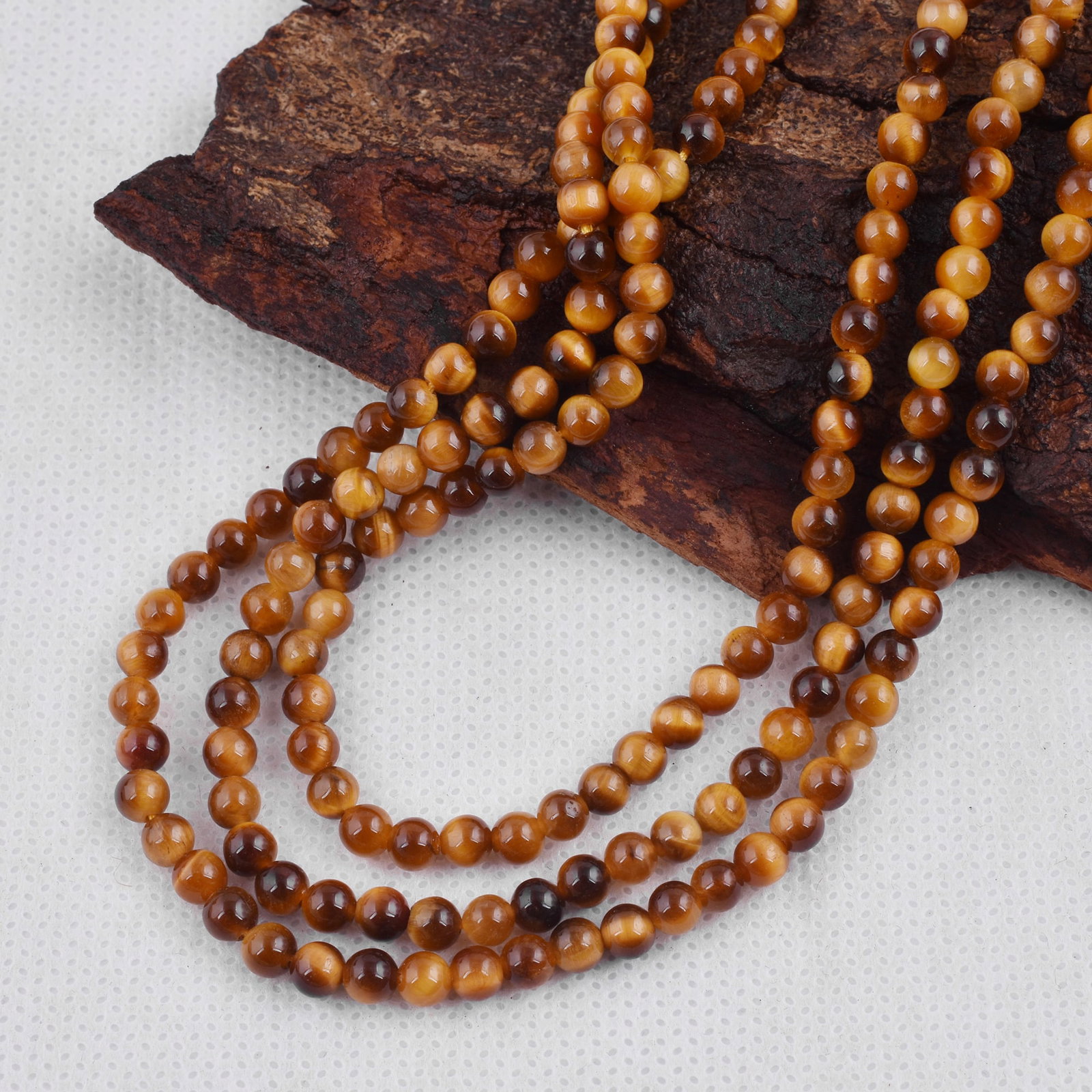 Natural Tiger's Eye Necklace 4 MM Round Smooth 3 String Beads Gemstone: Natural Tiger's Eye Gemstone 4 MM Round 3 Strings Smooth Beads Adjustable Necklace Product Type : Necklace Main Stone : Tiger's Eye Main Stone Shape : Round Main Stone Size : 4 MM Beads Type : Smoo