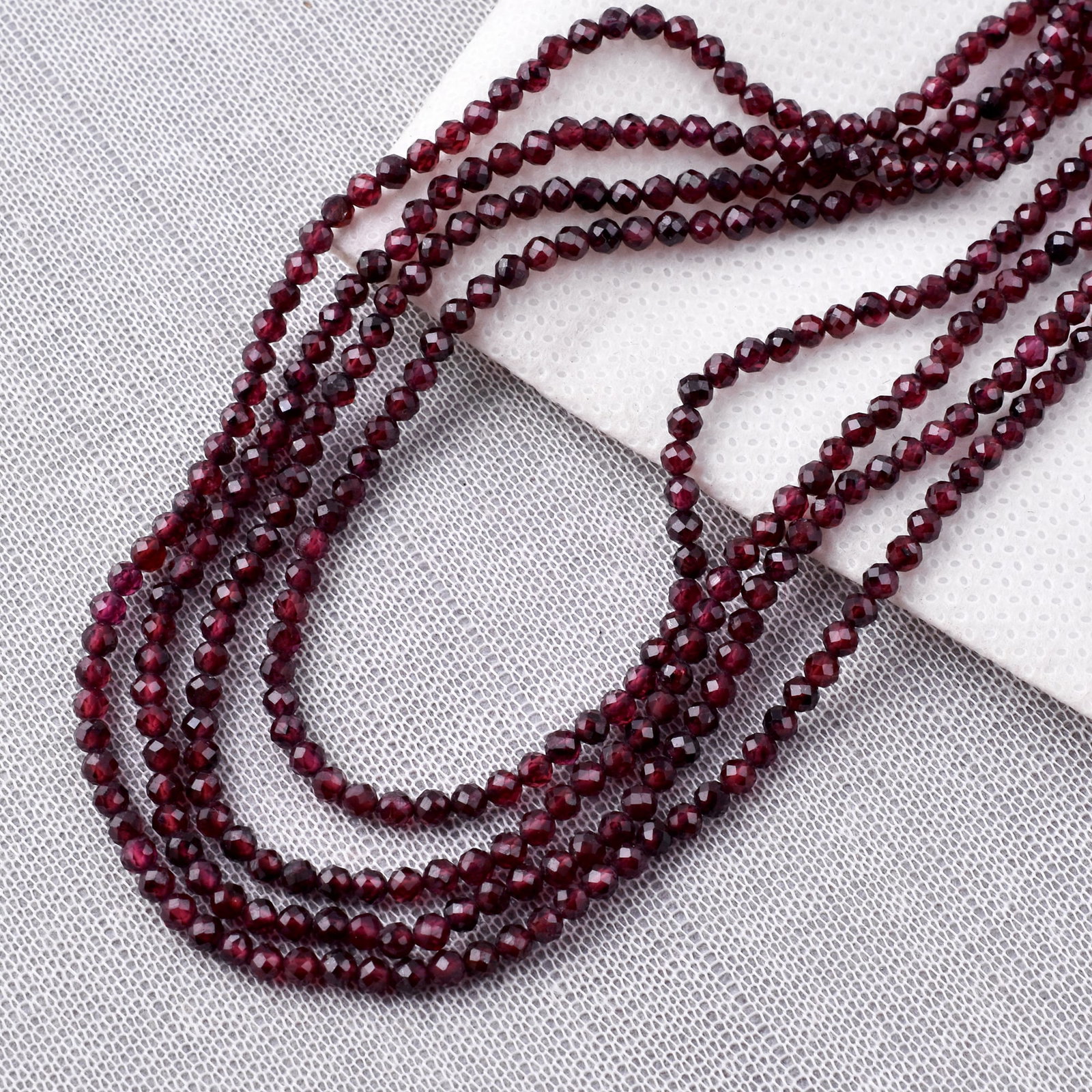 Natural Garnet 3 MM Round Faceted 4 String Beads Necklace: Natural Garnet 3 MM Round Faceted 4 String Beads Necklace Product Type : Necklace Main Stone : Garnet Main Stone Shape : Round Main Stone Size : 3 MM Beads Type : Faceted Closure Type : S