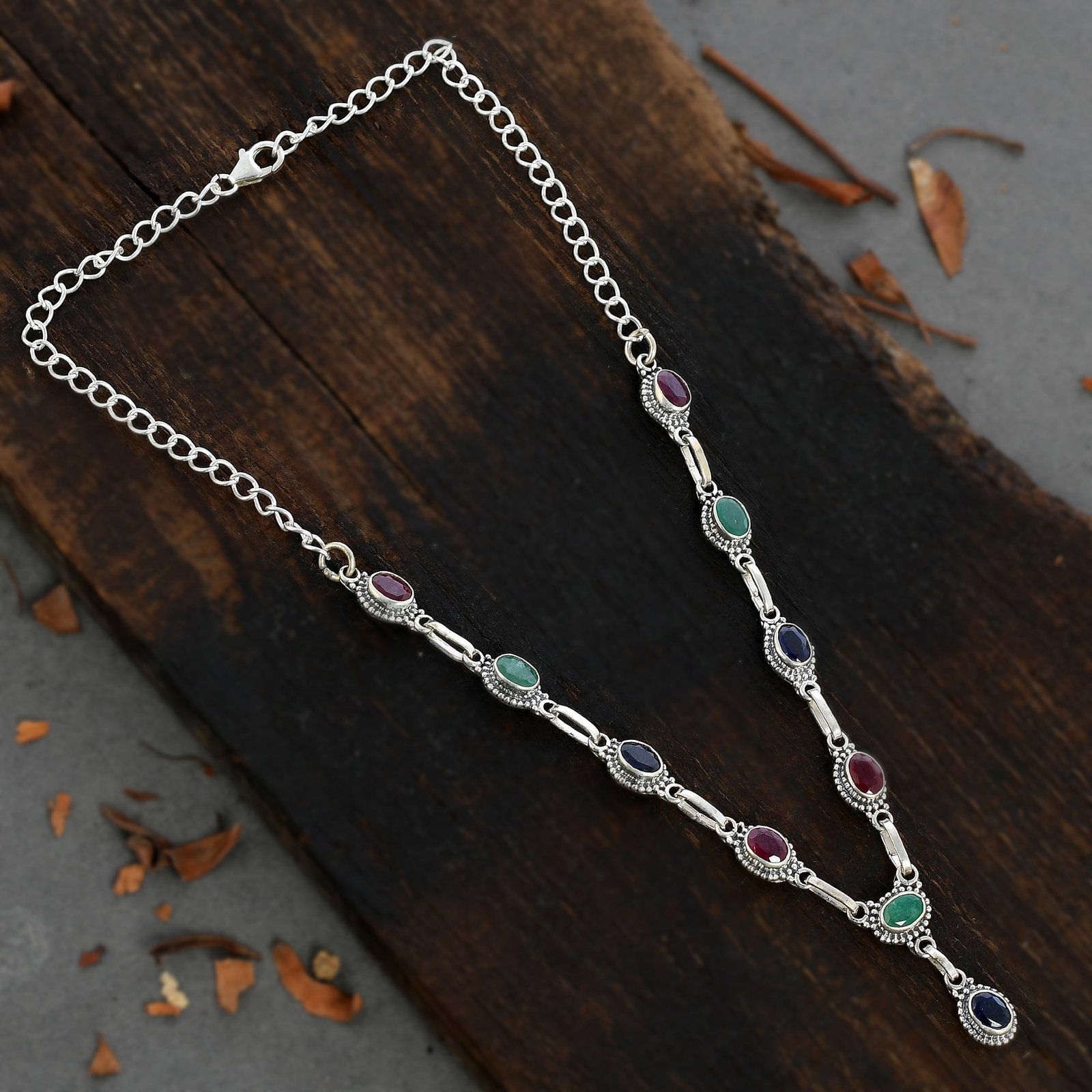 PRECIOUS MULTI GEMSTONE 92.5 STERLING SILVER NECKLACE: PRECIOUS MULTI GEMSTONE 92.5 STERLING SILVER NECKLACE Product Type : NECKLACE Main Stone : EMERALD/RUBY/SAPPHIRE Main Stone Shape : OVAL Main Stone Size : 7X5 MM Main Stone Color : MULTICOLOR Metal : 