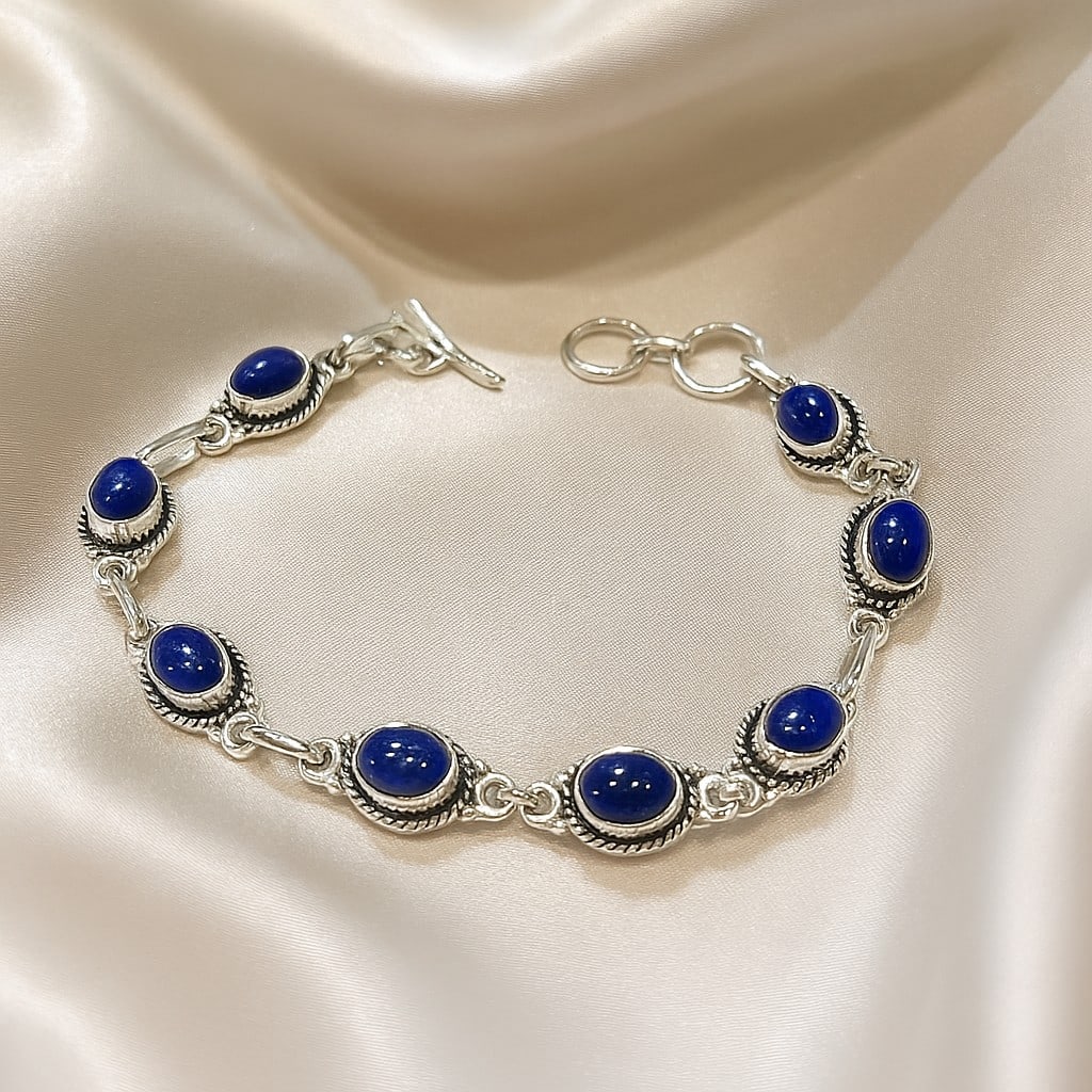 LAPIS LAZULI 92.5 STERLING SILVER BRACELET: LAPIS LAZULI 92.5 STERLING SILVER BRACELET Product Type : BRACELET Main Stone : LAPIS LAZULI Main Stone Shape : OVAL Main Stone Size : 7X5 MM Main Stone Color : BLUE Metal : STERLING SILVER Metal