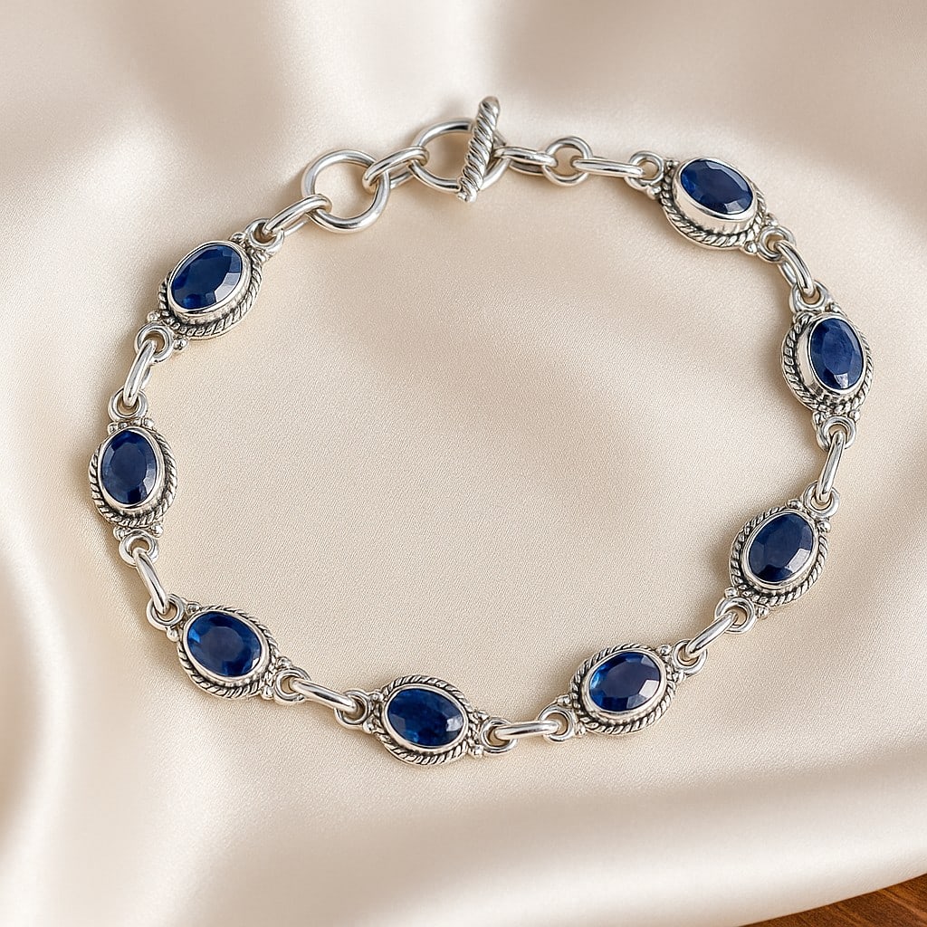 BLUE SAPPHIRE 92.5 STERLING SILVER BRACELET: BLUE SAPPHIRE 92.5 STERLING SILVER BRACELET Product Type : BRACELET Main Stone : SAPPHIRE Main Stone Shape : OVAL Main Stone Size : 7X5 MM Main Stone Color : BLUE Metal : STERLING SILVER Metal Purity 