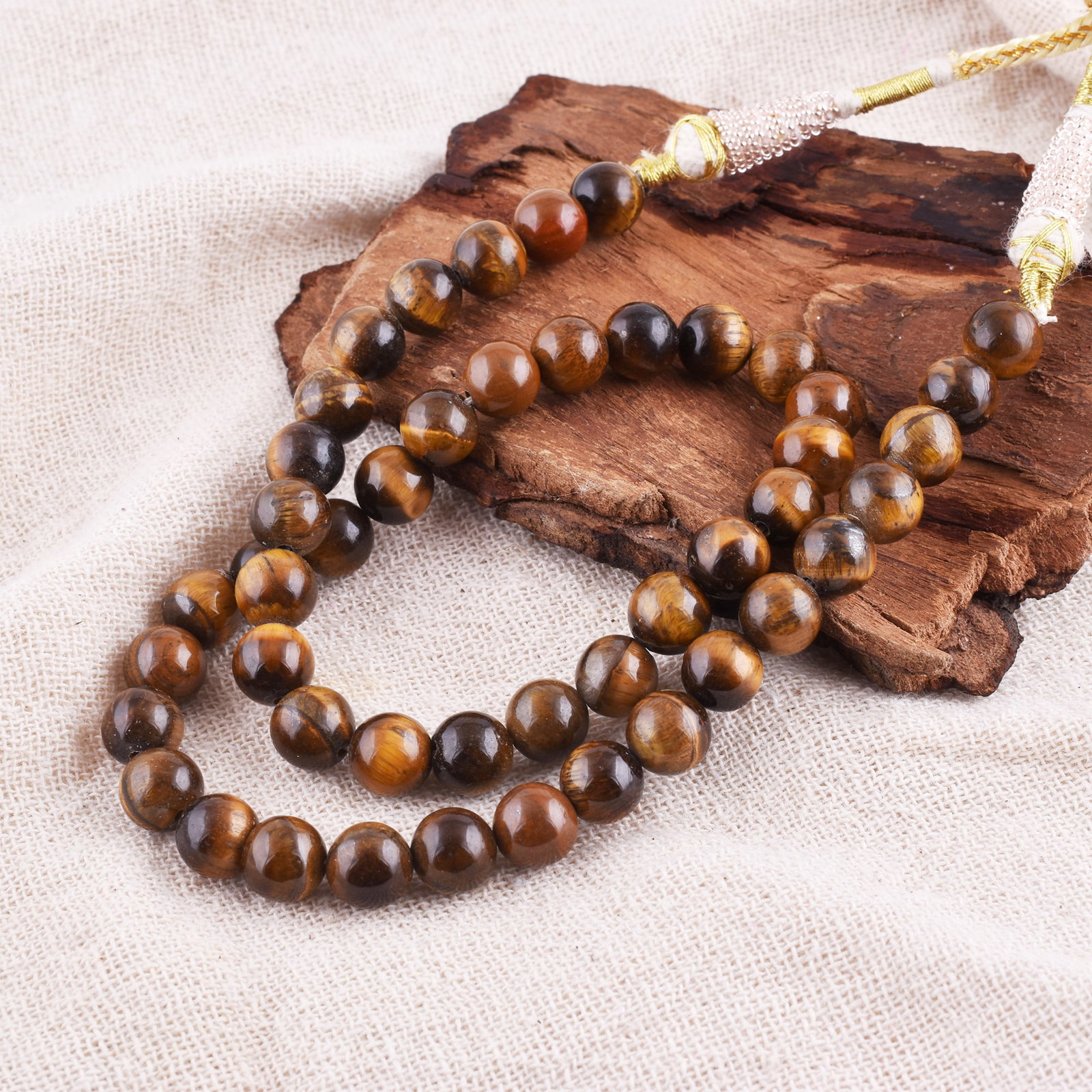 Natural Tiger's Eye Necklace 8 MM Round Smooth Beads Gemstone: NATURAL TIGER'S EYE GEMSTONE 8 MM ROUND SMOOTH BEADS ADJUSTABLE NECKLACE PRODUCT TYPE : NECKLACE MAIN STONE : TIGER'S EYE MAIN STONE SHAPE : ROUND MAIN STONE SIZE : 8 MM BEADS TYPE : SMOOTH