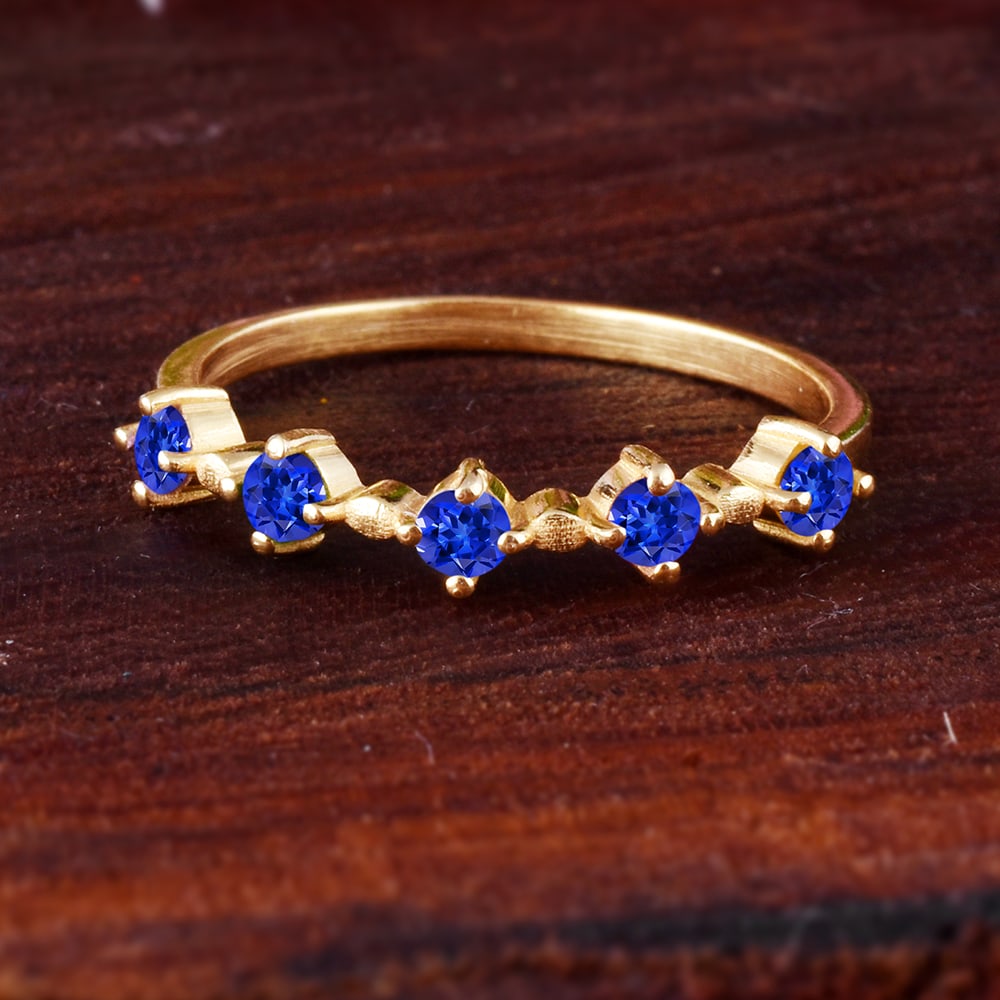 Natural Tanzanite 14 KT Yellow Gold Ring: Natural Tanzanite 14 KT Yellow Gold Ring Jewelry Type : Ring Main Stone : Tanzanite Main Stone Shape & Size : Round 2.5 MM Main Stone Color : Blue