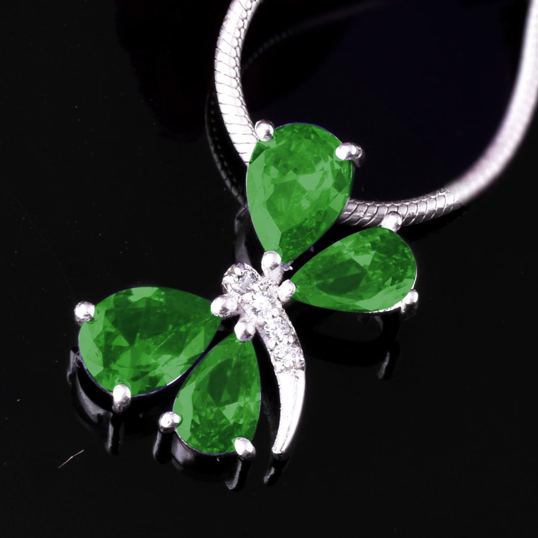 Natural Emerald & Diamond 14 KT White Gold Butterfly Pendant: Natural Emerald & Diamond 14 KT White Gold Butterfly Pendant Jewelry Type : Pendant Main Stone : Emerald & Diamond Main Stone Shape & Size : Pear 7x5 & 6x4 MM Main Stone Color : Green Diamond Shape &