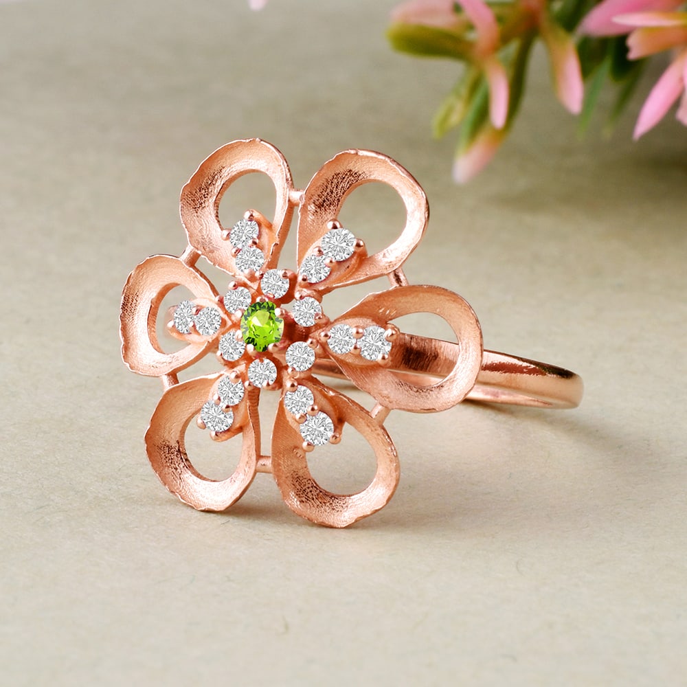 Natural Peridot & Diamond 14 KT Rose Gold Ring: Natural Peridot & Diamond 14 KT Rose Gold Ring Jewelry Type : Ring Main Stone : Peridot & Diamond Main Stone Shape & Size : Round 2 MM Main Stone Color : Green Diamond Shape & Size : Round 1.50 MM