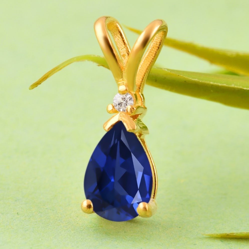 Natural Blue Sapphire & Diamond 14 KT White Gold Pendant: Natural Blue Sapphire & Diamond 14 KT White Gold Pendant Jewelry Type : Pendant Main Stone : Blue Sapphire & Diamond Main Stone Shape & Size : Pear 7x5 MM Main Stone Color : Blue Diamond Shape & Size