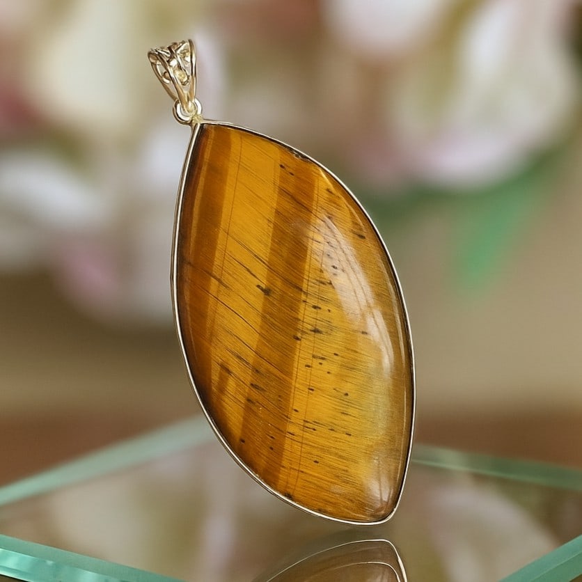 TIGER'S EYE 925 STERLING SILVER PENDANT: TIGER'S EYE 925 STERLING SILVER PENDANT Product Type : PENDANT Main Stone : TIGER'S EYE Main Stone Color : BROWN Metal : STERLING SILVER Metal Purity : 925 Pendant Size : 2.9" Inches Pendant Weight : 