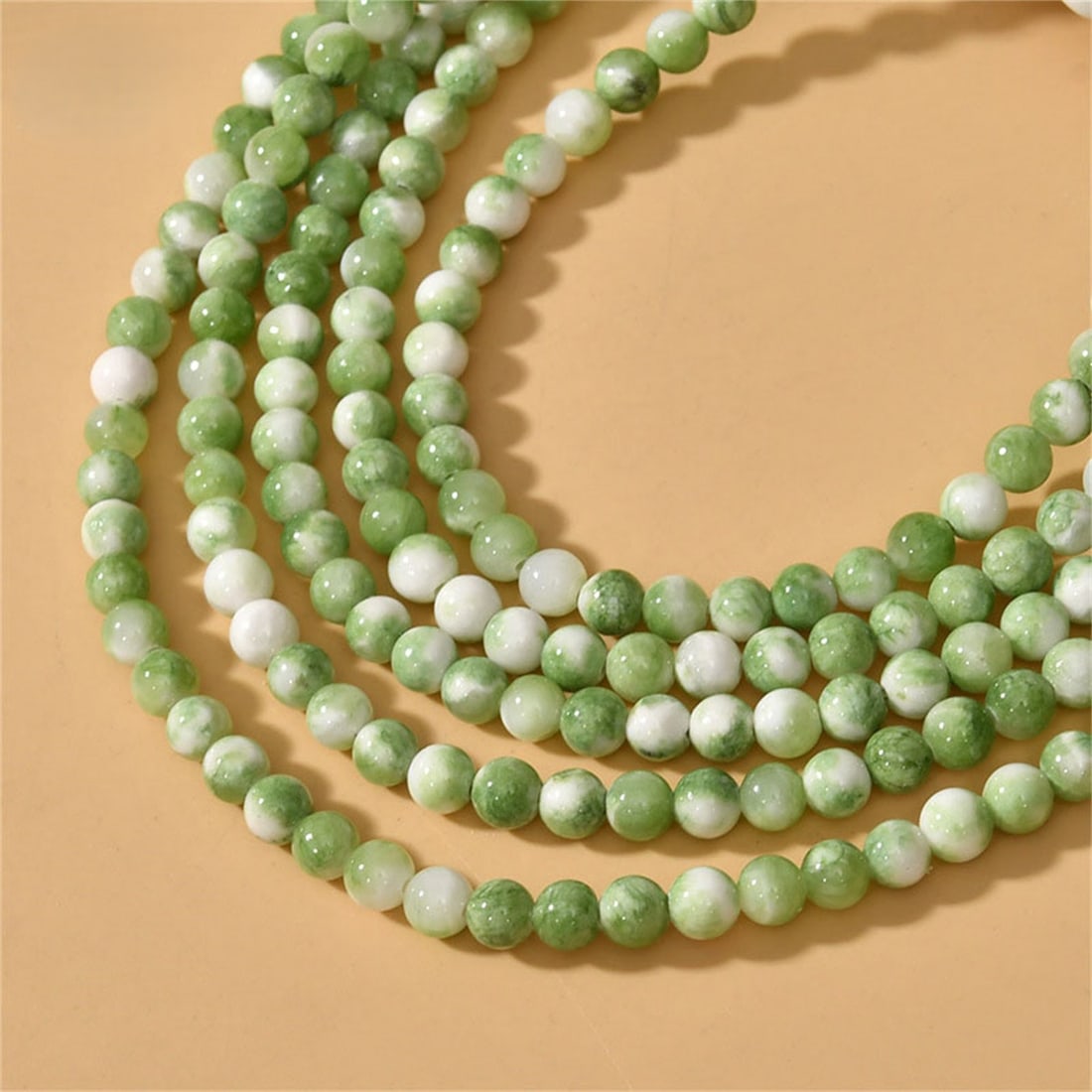 Natural Green White Persian Jade Gemstone 4 MM Round Smooth Plain Beads 10 Strand: Natural Green White Persian Jade Gemstone 4 MM Round Smooth Plain Beads 10 Strand Product Type : Loose Beads Strand Gemstone : Persian Jade Beads Shape : Round Smooth Plain Beads Size : 4 MM Q
