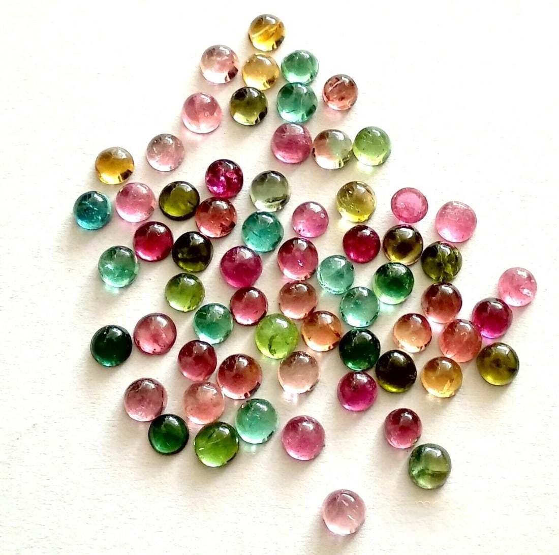 Multi Tourmaline 3 MM Round Cabochon 50 Pieces Lot: Natural Multi Tourmaline 3 MM Round Cabochon 50 Pieces Gemstone : Multi Tourmaline Shape : Round Size : 3 MM Color : Multi Color Type : Cabochon Quantity : 50 Pieces Weight