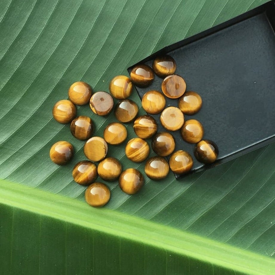 Tiger's Eye 5 MM Round Cabochon 50 Pieces: Natural Tiger's Eye 5 MM Round Cabochon 50 Pieces Gemstone : Tiger's Eye Shape : Round Size : 5 MM Color : Brown Type : Cabochon Quantity : 50 Pieces Weight : 26 Carats