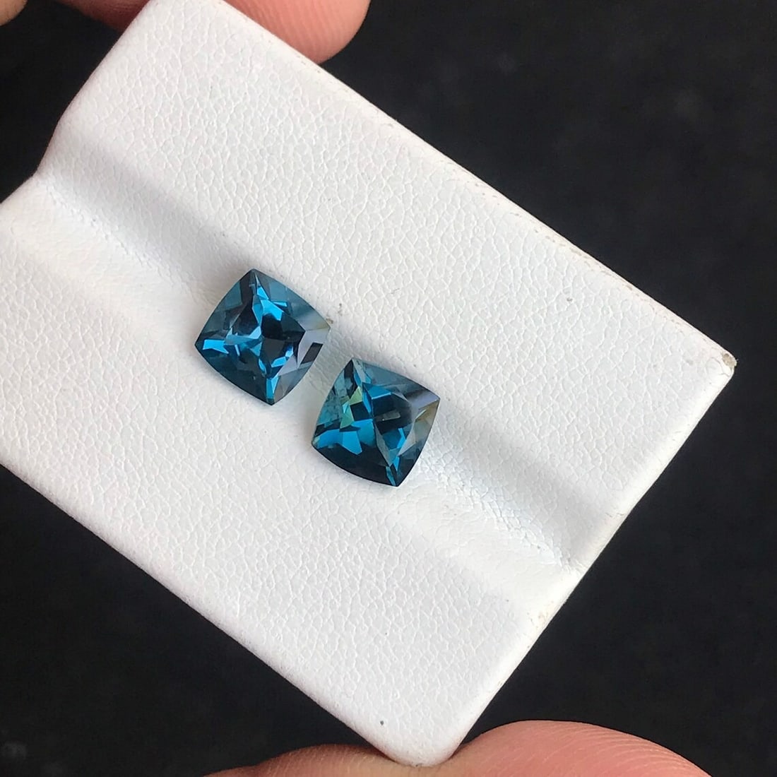 Natural London Blue Topaz 10x10 MM Cushion Cut Gemstone Pair: Natural London Blue Topaz 10x10 MM Cushion Cut Gemstone Pair Gemstone : London Blue Topaz Stone Shape : Cushion Stone Cutting Type : Faceted Cut Stone Weight : 9.85 Carats Stone Measurement :