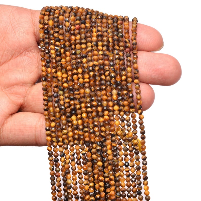 Natural Tiger's Eye Gemstone 3 mm Round Micro Faceted Beads 10 Strand: Natural Tiger's Eye Gemstone 3 mm Round Micro Faceted Beads 10 Strand Product Type : Loose Beads Strand Gemstone : Tiger's Eye Beads Shape : Round Micro Faceted Beads Size : 3 mm Quantity : </
