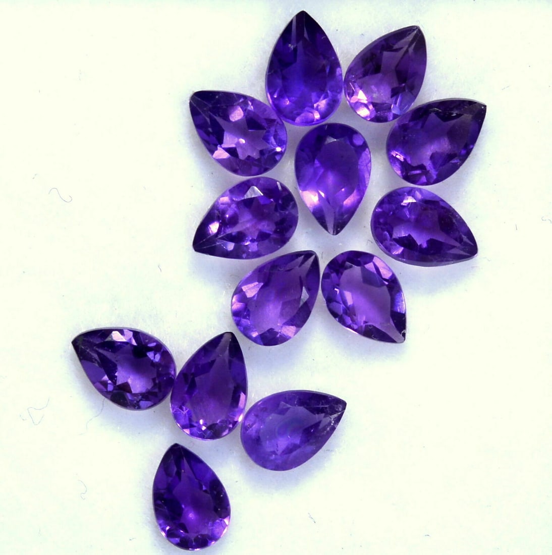 Amethyst 6x4 MM Pear Faceted Cut 100 Pieces: Natural Amethyst 6x4 MM Pear Faceted Cut 100 Pieces Gemstone : Amethyst Shape : Pear Size : 6x4 MM Color : Purple Type : Faceted Cut Quantity : 100 Pieces Weight : 38 C