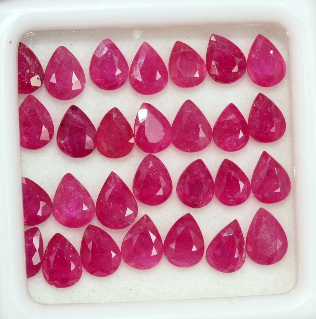 Ruby 5x4 MM Pear Faceted Cut 25 Pieces: Natural Ruby 5x4 MM Pear Faceted Cut 25 Pieces Gemstone : Ruby Shape : Pear Size : 5x4 MM Color : Red Type : Faceted Cut Quantity : 25 Pieces Weight : 10.5 Carats