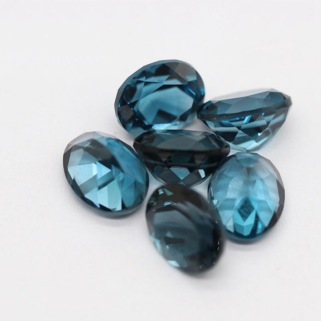 London Blue Topaz 9x7 MM Oval Faceted Cut 5 Pieces: Natural London Blue Topaz 9x7 MM Oval Faceted Cut 5 Pieces Gemstone : London Blue Topaz Shape : Oval Size : 9x7 MM Color : London Blue Type : Faceted Cut Quantity : 5 Pieces <