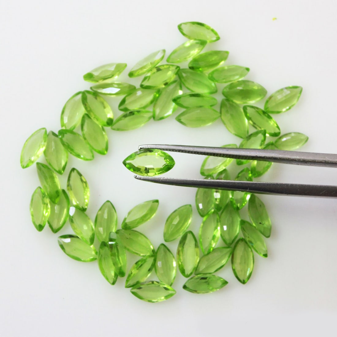 Peridot 5x10 MM Marquise Faceted Cut 20 Pieces: Natural Peridot 5x10 MM Marquise Faceted Cut 20 Pieces Gemstone : Peridot Shape : Marquise Size : 5x10 MM Color : Green Type : Faceted Cut Quantity : 20 Pieces Weight :