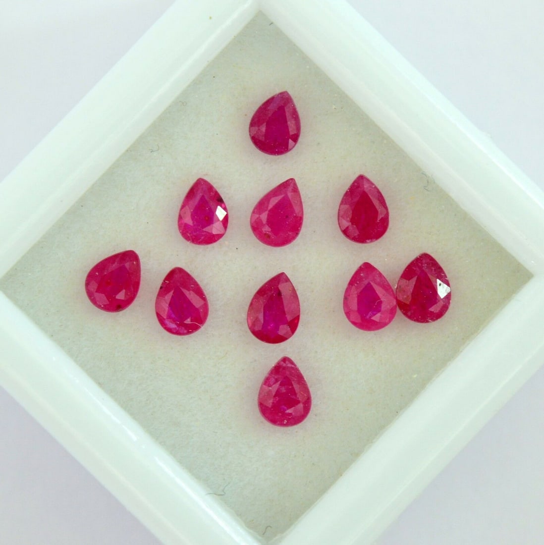 Ruby 4x3 MM Pear Faceted Cut 25 Pieces: Natural Ruby 4x3 MM Pear Faceted Cut 25 Pieces Gemstone : Ruby Shape : Pear Size : 4x3 MM Color : Red Type : Faceted Cut Quantity : 25 Pieces Weight : 5.75 Carats