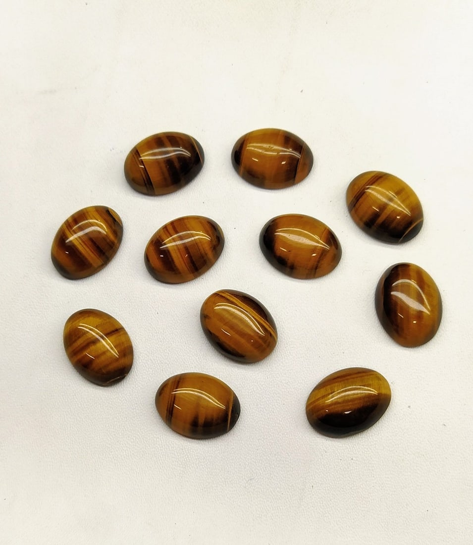 Tiger's Eye 8x6 MM Oval Cabochon 25 Pieces: Natural Tiger's Eye 8x6 MM Oval Cabochon 25 Pieces Gemstone : Tiger's Eye Shape : Oval Size : 8x6 MM Color : Brown Type : Cabochon Quantity : 25 Pieces Weight : 38.5 Ca