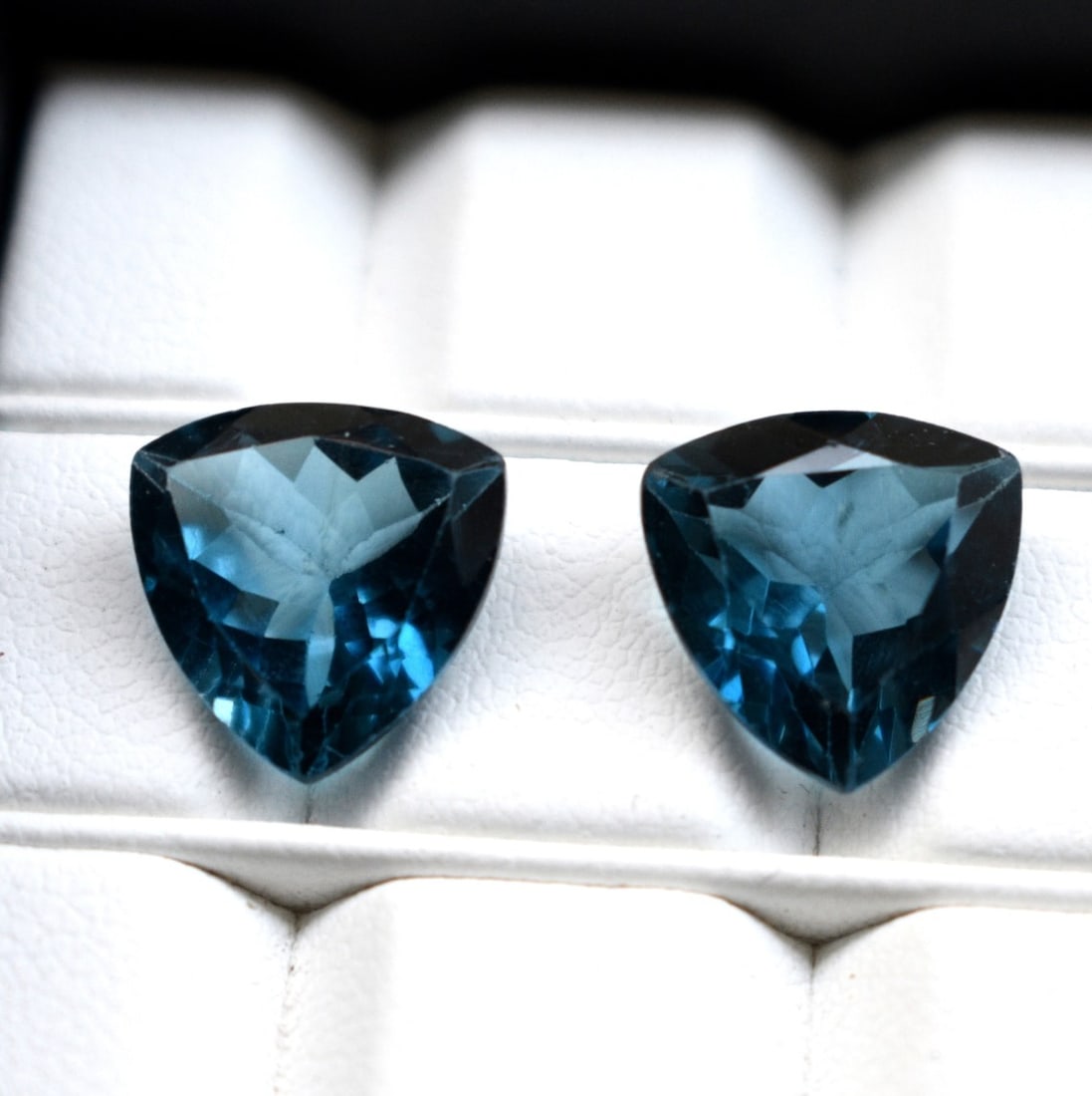 Natural London Blue Topaz 12 MM Trillion Cut Gemstone Pair: Natural London Blue Topaz 12 MM Trillion Cut Gemstone Pair Gemstone : London Blue Topaz Stone Shape : Trillion Stone Cutting Type : Faceted Cut Stone Weight : 14.13 Carats Stone Measurement :