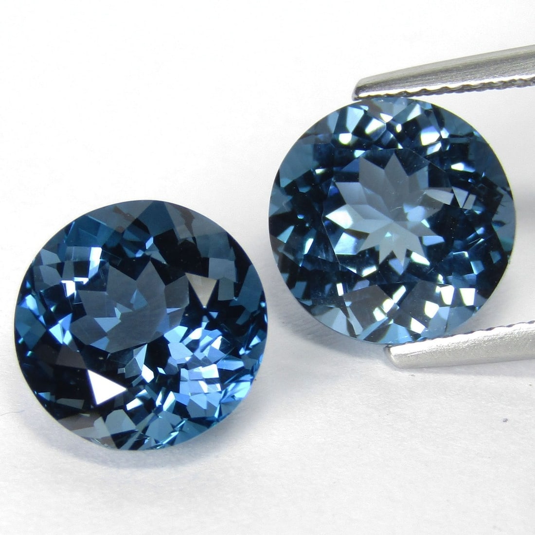 Natural London Blue Topaz 12 MM Round Cut Gemstone Pair: Natural London Blue Topaz 12 MM Round Cut Gemstone Pair Gemstone : London Blue Topaz Stone Shape : Round Stone Cutting Type : Faceted Cut Stone Weight : 14.00 Carats Stone Measurement : 12