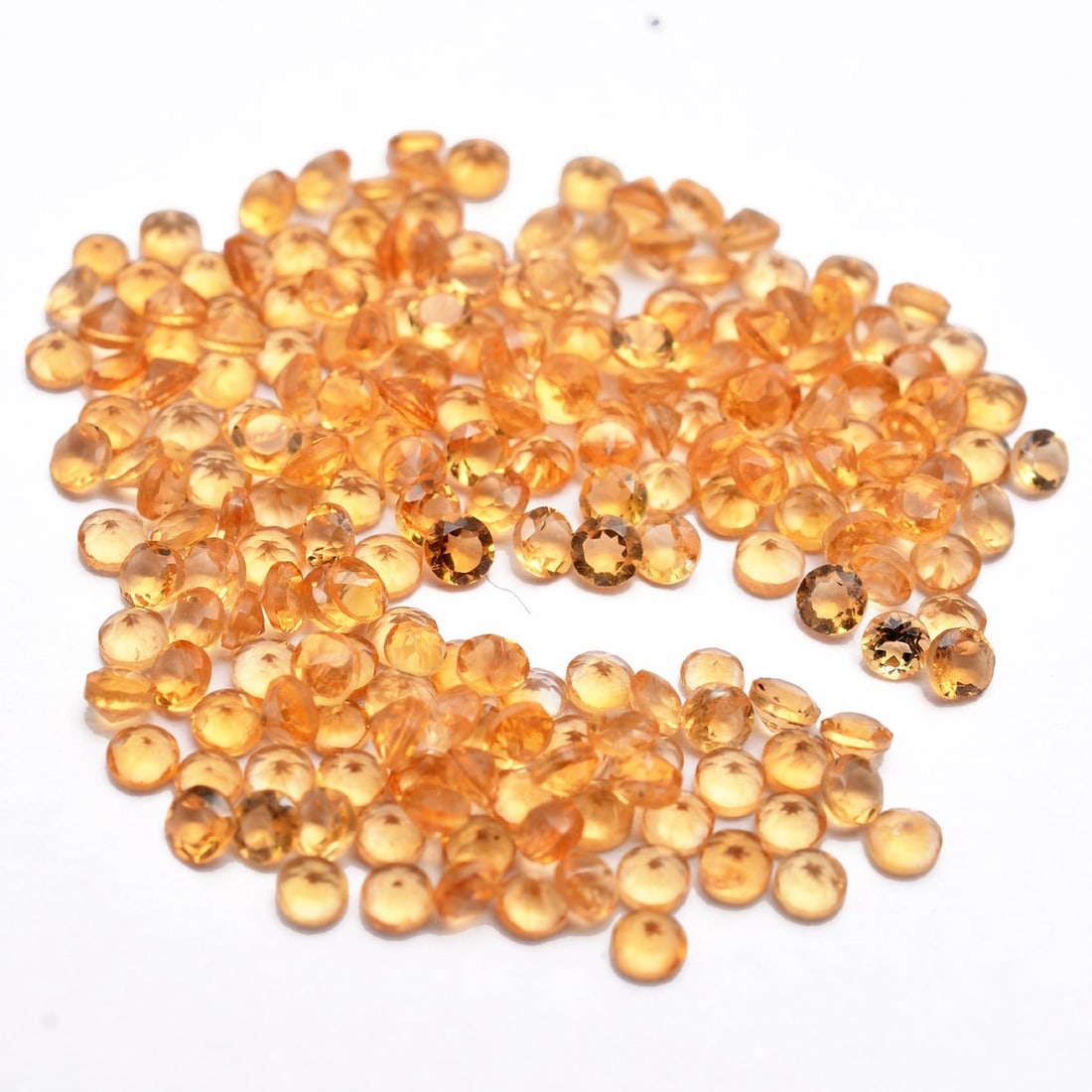 Citrine 2 MM Round Faceted Cut 250 Pieces: Natural Citrine 2 MM Round Faceted Cut 250 Pieces Gemstone : Citrine Shape : Round Size : 2 MM Color : Yellow Type : Faceted Cut Quantity : 250 Pieces Weight : 7.5 Cara