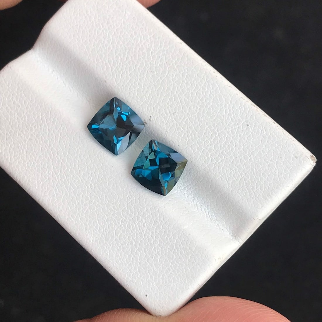 Natural London Blue Topaz 13x13 MM Cushion Cut Gemstone Pair: Natural London Blue Topaz 13x13 MM Cushion Cut Gemstone Pair Gemstone : London Blue Topaz Stone Shape : Cushion Stone Cutting Type : Faceted Cut Stone Weight : 24.15 Carats Stone Measurement :