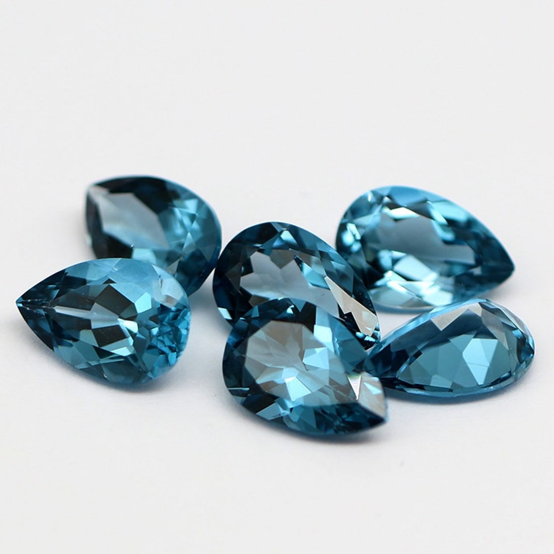 London Blue Topaz 9x7 MM Pear Faceted Cut 5 Pieces: Natural London Blue Topaz 9x7 MM Pear Faceted Cut 5 Pieces Gemstone : London Blue Topaz Shape : Pear Size : 9x7 MM Color : London Blue Type : Faceted Cut Quantity : 5 Pieces <