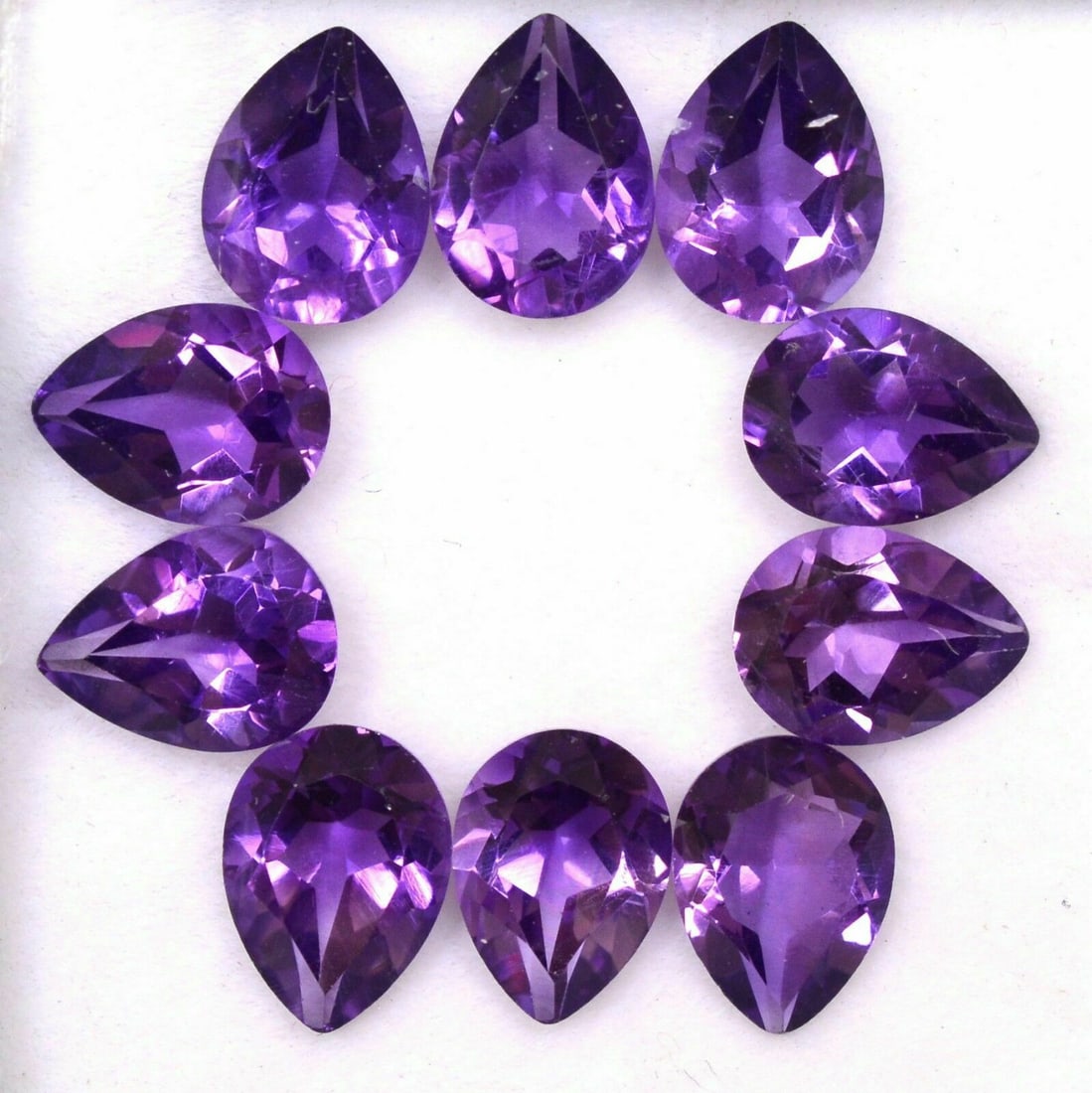 Amethyst 9x7 MM Pear Faceted Cut 25 Pieces: Natural Amethyst 9x7 MM Pear Faceted Cut 25 Pieces Gemstone : Amethyst Shape : Pear Size : 9x7 MM Color : Purple Type : Faceted Cut Quantity : 25 Pieces Weight : 39 Car