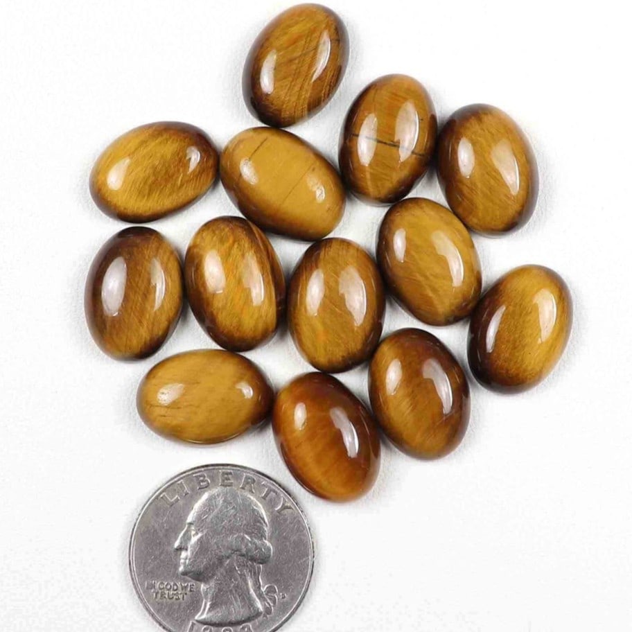 Tiger's Eye 9x7 MM Oval Cabochon 20 Pieces: Natural Tiger's Eye 9x7 MM Oval Cabochon 20 Pieces Gemstone : Tiger's Eye Shape : Oval Size : 9x7 MM Color : Brown Type : Cabochon Quantity : 20 Pieces Weight : 46 Cara