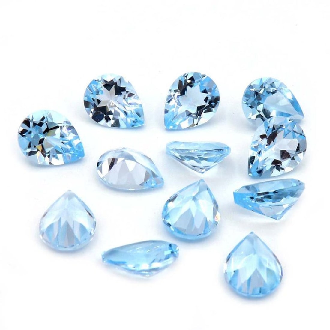 Blue Topaz 8x5 MM Pear Faceted Cut 20 Pieces: Natural Blue Topaz 8x5 MM Pear Faceted Cut 20 Pieces Gemstone : Blue Topaz Shape : Pear Size : 8x5 MM Color : Sky Blue Type : Faceted Cut Quantity : 20 Pieces Weight :