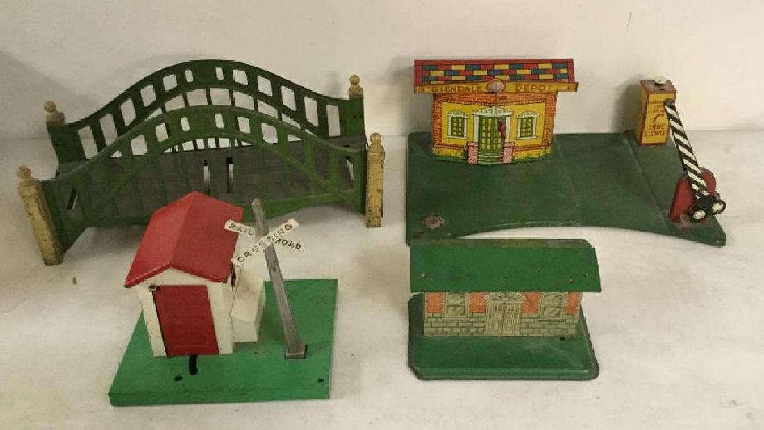 (4) OLDER TIN LITHO TRAIN ACCESSORIES IN AS FOUND: (4) OLDER TIN LITHO TRAIN ACCESSORIES IN AS FOUND ESTATE CONDITION.