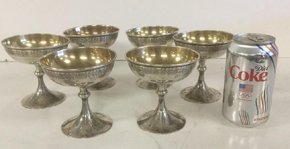 6 STERLING DESSERT GOBLETS WEIGHING 21.03 TROY OUNCES.: 6 STERLING DESSERT GOBLETS WEIGHING 21.03 TROY OUNCES. MONOGRAMMED AS PICTURED, MEASURE 4 1/8" HIGH, NICE CONDITION. HALLMARKED WITH A W 4181.