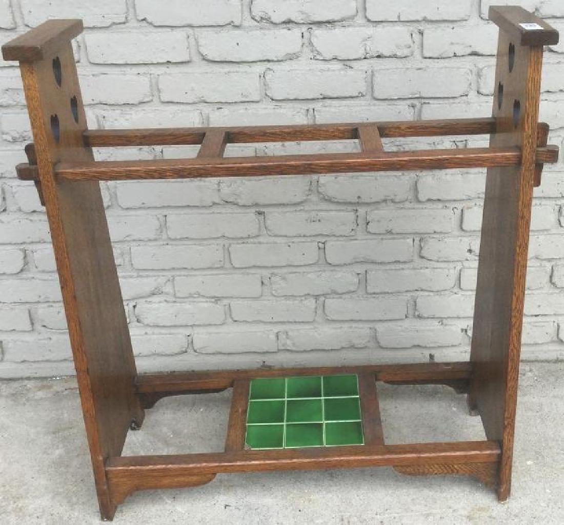 LIBERTY MISSION OAK UMBRELLA STAND W/GREEN TILES, CUT: LIBERTY MISSION OAK UMBRELLA STAND W/GREEN TILES, CUT OUT HEARTS ON THE SIDES, MEASURES 33 1/2" HIGH & 31" ACROSS, AS PICTURED