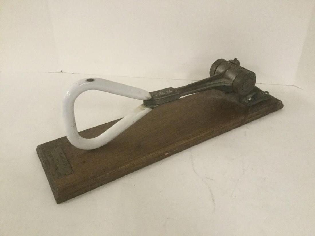 OLD NEW YORK SUBWAY CAR STRAP HANGER, MOUNTED ON WOOD: OLD NEW YORK SUBWAY CAR STRAP HANGER, MOUNTED ON WOOD BOARD, WRITING SAYS RICO TYPE-16A PATENTED, HAS WHITE ENAMEL HANDLE, BOARD MEASURES 19" TOP TO BOTTOM, AS PICTURED