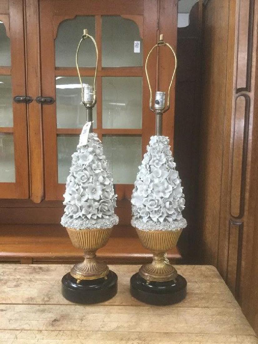 PR OF HIGHLY DECORATIVE TABLE LAMPS W/WHITE GLAZE: PR OF HIGHLY DECORATIVE TABLE LAMPS W/WHITE GLAZE CERAMIC FLOWERS ON PAINTED GILT METAL URN BASE, ON BLACK WOOD BASES, REMARKABLE CONDITION FOR THEIR DELICACY, LAMPS MEASURE 33" TO TOP OF HARPS, AS PI