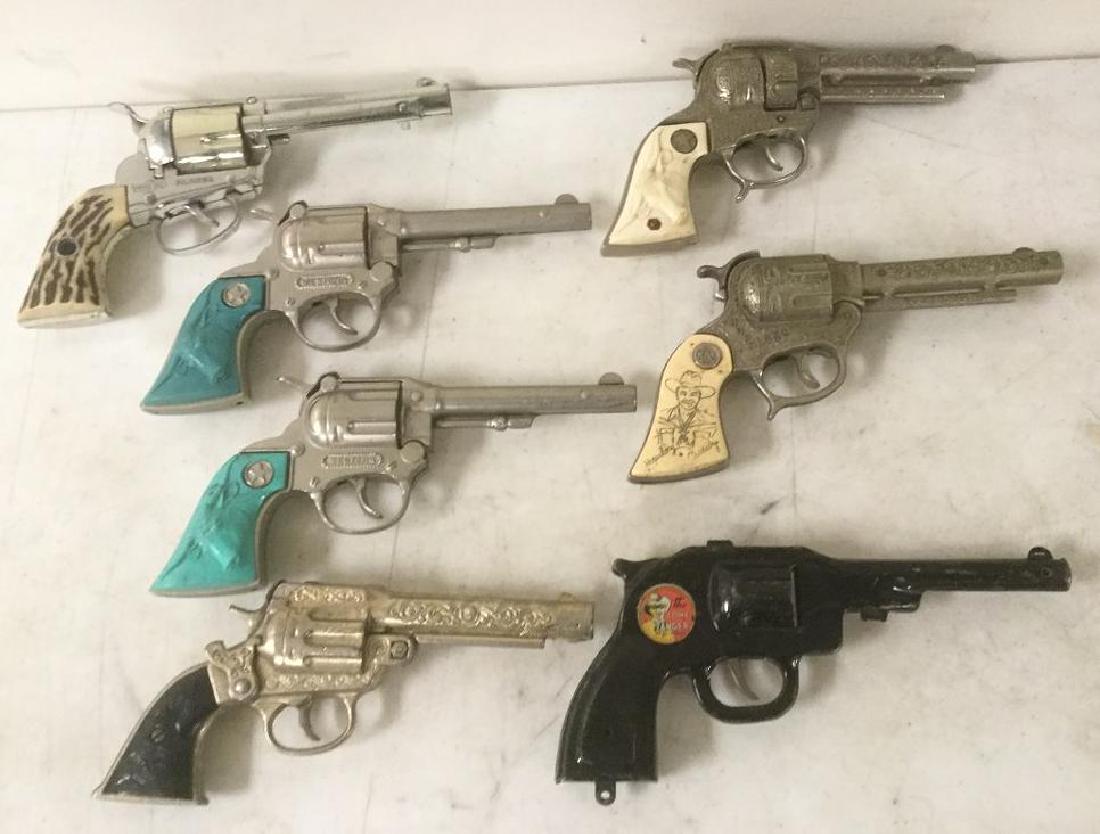 LOT OF 7 OLDER WESTERN CAP GUNS INCLUDING TEXAN JR.,: LOT OF 7 OLDER WESTERN CAP GUNS INCLUDING TEXAN JR., HOPALONG CASSIDY, PEACE MAKER, FANNER, WESTERN, AND THE LONE RANGER, CONDITION AS PICTURED