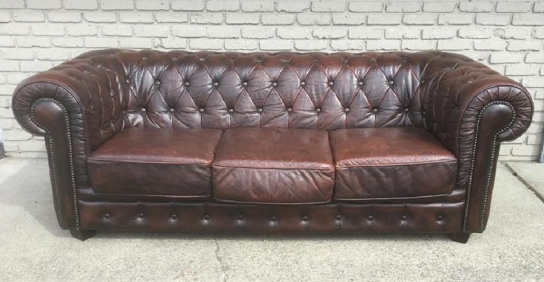 LEATHER CHESTERFIELD SOFA, IN NICE CONDITION, MEASURES: LEATHER CHESTERFIELD SOFA, IN NICE CONDITION, MEASURES 84" ACROSS, 35" FRONT TO BACK, HAS A BRITISH LABEL ON IT, AS PICTURED