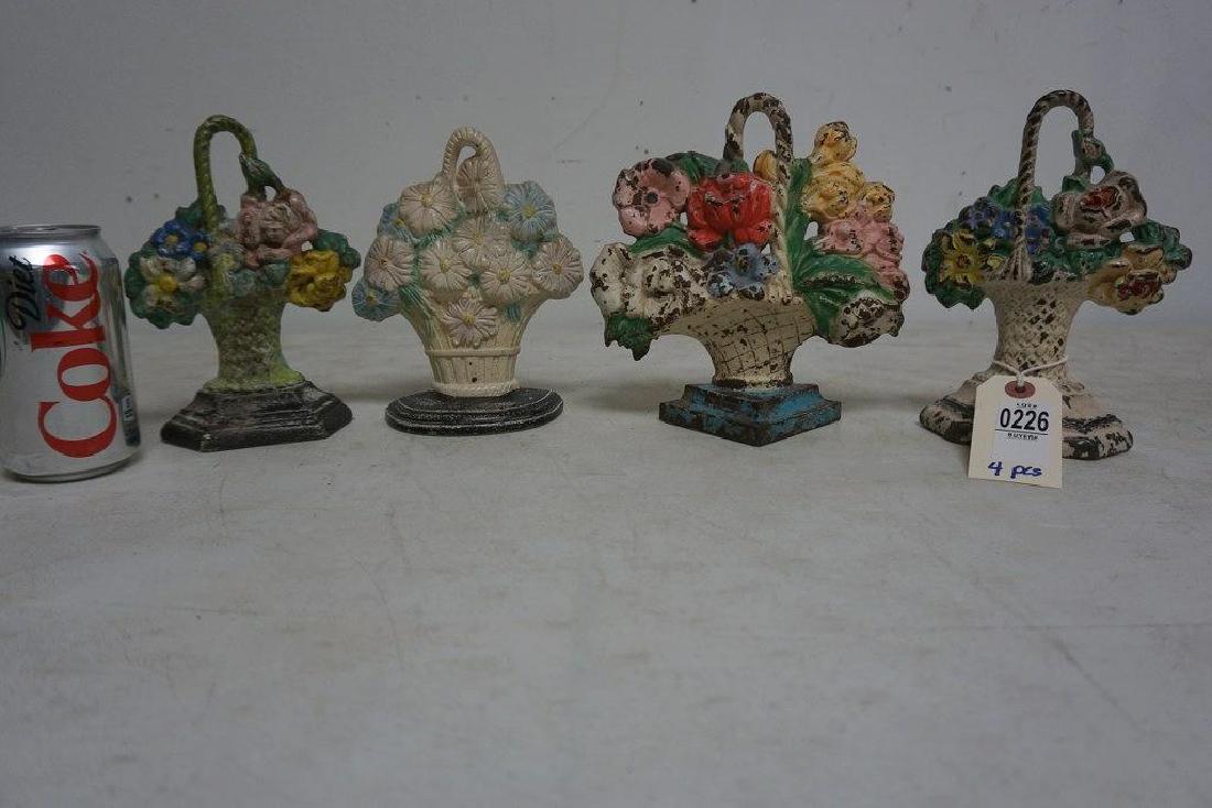(4) OLDER CAST IRON FLORAL DOORSTOPS, FROM HUDSON (1 of 1)