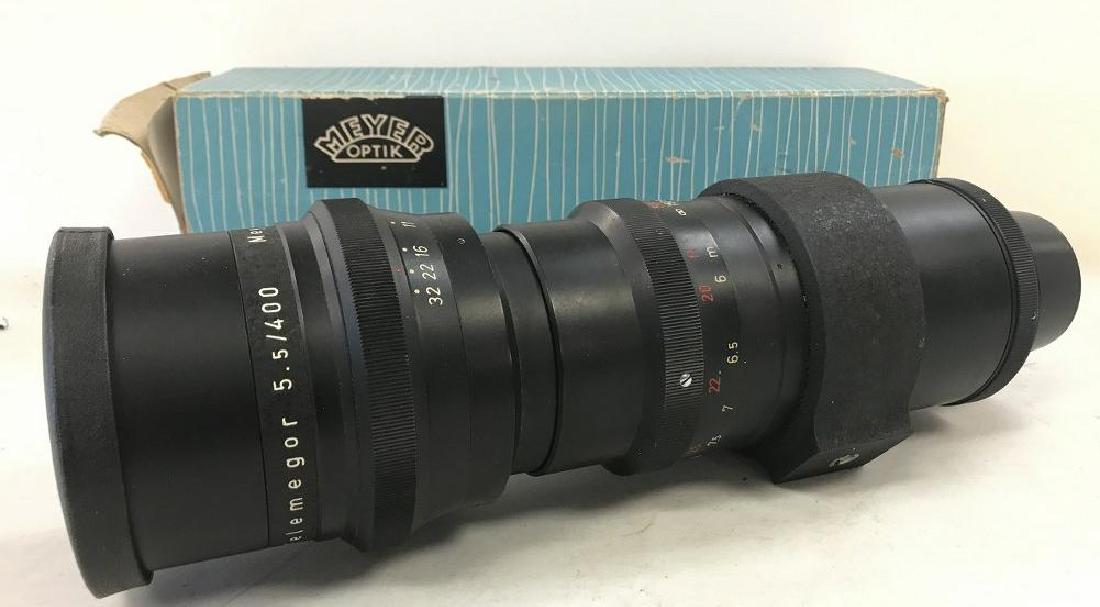 MEYER OPTIC TELEMEGOR 1:55 /400 MM VERY GOOD CONDITION: MEYER OPTIC TELEMEGOR 1:55 /400 MM VERY GOOD CONDITION EXACTA MOUNT PARTIALLY CONVERTED FOR NIKON RANGEFINDER, NIKON RANGEFINDER MOUNT INCLUDED, ORIGINAL BOX, SOME TATTERING TO BOX.