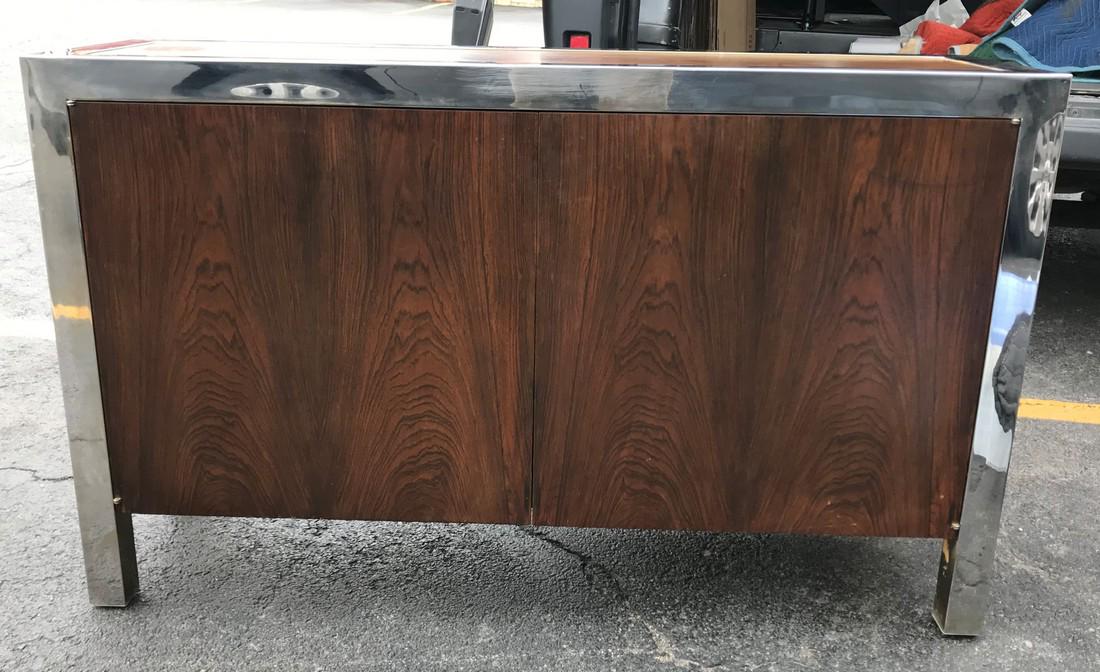 DUNBAR MID CENTURY ROSEWOOD 2 DOOR CABINET WITH: DUNBAR MID CENTURY ROSEWOOD 2 DOOR CABINET WITH STAINLESS STEEL FRAME, FINISHED SIDES AND BACK, VERY NICE CONDITION, SHELF INSIDE, MEASURES 29" HIGH, 48" WIDE & 14" DEEP, AS PICTURED