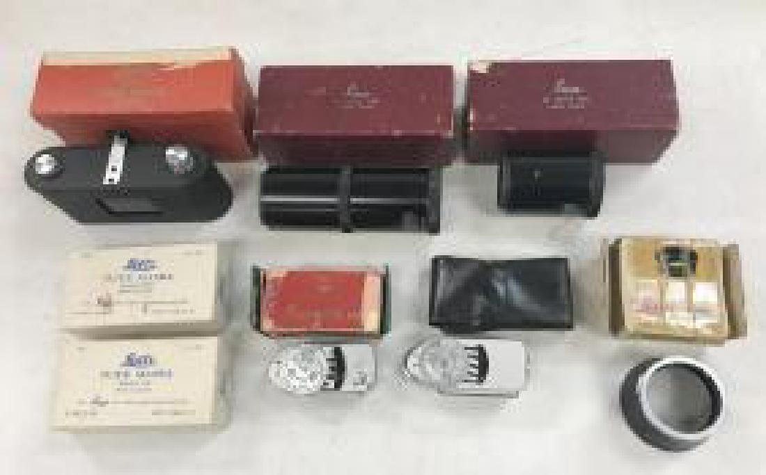 LEICA VINTAGE CAMERA ACCESSORIES LOT. IN ORIGINAL BOXES: LEICA VINTAGE CAMERA ACCESSORIES LOT. IN ORIGINAL BOXES AND CASE. 2 BOXES OF SLIDE MASKS, 2 LIGHT METERS, LEICA ITDOO, 90 MM EXTENSION TUBE, 60 MM EXTENSION TUBE(LOOKS LIKE SOMETHING ELSE WAS IN BOX),