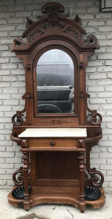 LARGE VICTORIAN WALNUT HALL TREE W/MARBLE TOP, CAST: LARGE VICTORIAN WALNUT HALL TREE W/MARBLE TOP, CAST IRON SHELL INSERTS FOR UMBRELLAS, HAS 1 DRAWER, ESTATE FOUND CONDITION, MEASURES 88" HIGH, 42" ACROSS, AS PICTURED