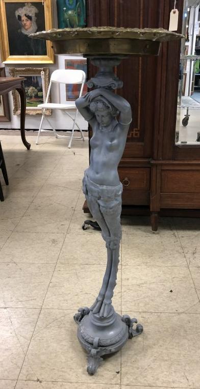 CIRCA 1900 FIGURAL WOMAN WITH HOOF FEET STAND & ONYX TO: CIRCA 1900 STAND WITH FIGURAL WOMAN, WITH HOOFED FEET, BRASS TRIM TOP , WITH ONYX CENTER, PROBABLY WAS PAINTED OR HAD A FINISH AT ONE TIME, VERY HEAVY, FEELS LIKE A LEAD LIKE MATERIAL, SOME OLD REPAIR