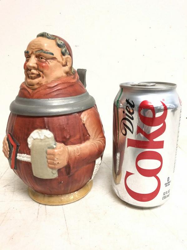 OLD FIGURAL GERMAN STEIN OF MONK HOLDING A BEER &: OLD FIGURAL GERMAN STEIN OF MONK HOLDING A BEER & BIBLE, MEASURES 7 1/4" HIGH, VERY NICE ESTATE CONDITION, MADE IN WESTERN GERMANY ON BASE & NUMBERS 4107.
