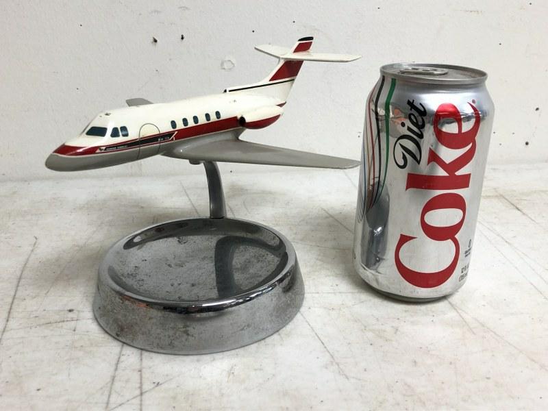 1960: 1960'S HAWKER SIDDELEY METAL AIRPLANE ON CHROME STAND, ORIGINAL PAINT, ON BOTTOM IS LABEL, WITH DENMARK, AS PICTURED. MEASURES 5" HIGH, WINGS ARE 7 1/4" ACROSSâ€¦..