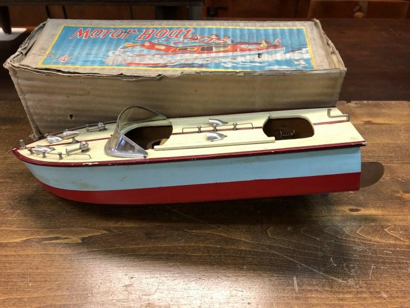 1950'S JAPAN WOOD MOTOR BOAT IN ORIGINAL BOX: 1950'S JAPAN WOOD MOTOR BOAT IN ORIGINAL BOX, FROM ATTIC OF LOCAL ESTATE. BOAT MEASURES 12 1/4" LONG, MOTOR INTACT AS PICTURED.