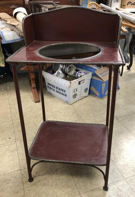 METAL COUNTRY WASHSTAND IN OLDER RED PAINT, NEEDS A: METAL COUNTRY WASHSTAND IN OLDER RED PAINT, NEEDS A BOWL, MEASURES 39" HIGH TO TOP OF BACKSPLASH. HAS TOWEL BAR, 20 1/2" WIDE.